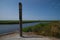 High water mark column at Vidaa, Wadden Sea, Denmark