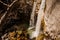 High waterfall flowing into the river in Georgia. Martvili canyon. Okatse canyon