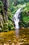 High waterfall Kamienczyk near the town Sklarska Poreba - vertical