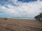 High Waves, Driftwood, Clouds and a Fishing Pier