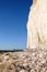 High white chalk cliff face with big white chalk boulders on the