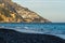 high and winding mountains, beach and sea typical of the town of Positano, Italy.