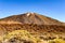 Highest Peak Behind Arid Lava Rocks On A Sunny And Very Clear Day In El Teide National Park. April 13, 2019. Santa Cruz De