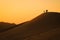 The highest sand dunes in the world at sunset in the Namib Desert, in the Namib-Nacluft National Park in Namibia. People on the to