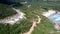 Highland highway meandering among forest and ocean beach