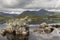 Highland watery reflections and tall mountains