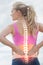 Highlighted spine of woman with back pain