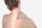 Highlighted spine of woman with neck pain