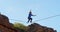 Highline athlete walking on slackline in mountains 4k