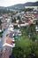 Highly detailed aerial city view with crossroads, roads, houses, parks, parking lots, bridges