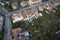 Highly detailed aerial city view with crossroads, roads, houses, parks, parking lots, gardens