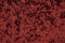 Highly detailed texture background of a red or wine color velour cloth that showcases a luxurious feel.