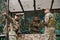 A highly trained military unit strategizes and organizes a tactical mission while studying a military map during a