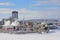 Highrise office towers, industrial buildings and national history museumin Hull district in winter, along frozen Ottawa river.