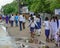 Highschool students walking on road