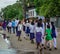 Highschool students walking on road