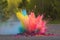 highspeed capture of colorful paint bomb exploding on ground