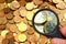 Highther valueted coins by magnifier