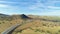 Highway 51 and Hilly Green Farmland. Kern County. California, USA. Aerial View