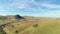 Highway 51 and Hilly Green Farmland. Kern County. California, USA. Aerial View