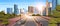 Highway asphalt road with marking arrows traffic signs city skyline modern skyscrapers cityscape sunshine background