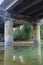 Highway bridge over the river calm as a mirror