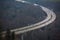 Highway on columns in a valley from afar and above