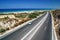 Highway in crete with beach and sea as background.