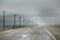 Highway in the farmland in under the dark cloudy sky in Colorado, Kansas, Oklahoma, Missouri