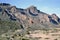 Highway at foot of pink mountains at Tenerife