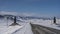 The highway goes off into the distance through a snow-covered valley