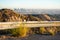 Highway guardrail barrier on road leading to the top of Mount Lee in Santa Monica mountains. Blurred Los Angeles downtown