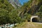 The highway is hidden in a tunnel carved into the mountain.
