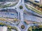 Highway interchange junction with traffic aerial top down view photography from drone with vehicles driving on freeway, roundabout