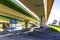 Highway, overpasses and colored concrete columns.