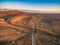 Highway passing through Flinders Ranges at dusk.