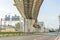 Highway pillars, urban interchange, turns and bends. View from under the bridge