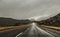 Highway through rainy landscape