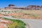 Highway running through colorful painted desert in central Utah near Canyonland Zion Bryce and Goblin Valley