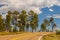 A highway runs along the red-sandstone.