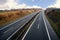 Highway runs through a rural landscape in northern Germany, also