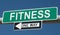 Highway sign for FITNESS and ONE WAY