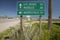 A highway sign pointing to Las Vegas, Bakersfield and Needles, CA