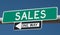 Highway signs for SALES and ONE WAY