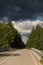 Highway to hell. Car road, bridge and clouds of storm, natural environment background.