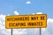 Highway warning sign about hitchhikers that might be escaping in