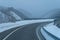 Highway in wintertime or Winter road in a blizzard