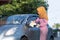 Hijab woman cleaning rear view a mirror  at outdoors area