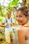 Hike backpackers tourists outdoor travel lifestyle young people walking in forest on trail smiling happy.Two adults couple on