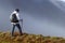 Hiker above the clouds